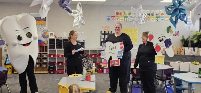 dental hygienists from Waushara Dental educate school children on healthy oral habits.